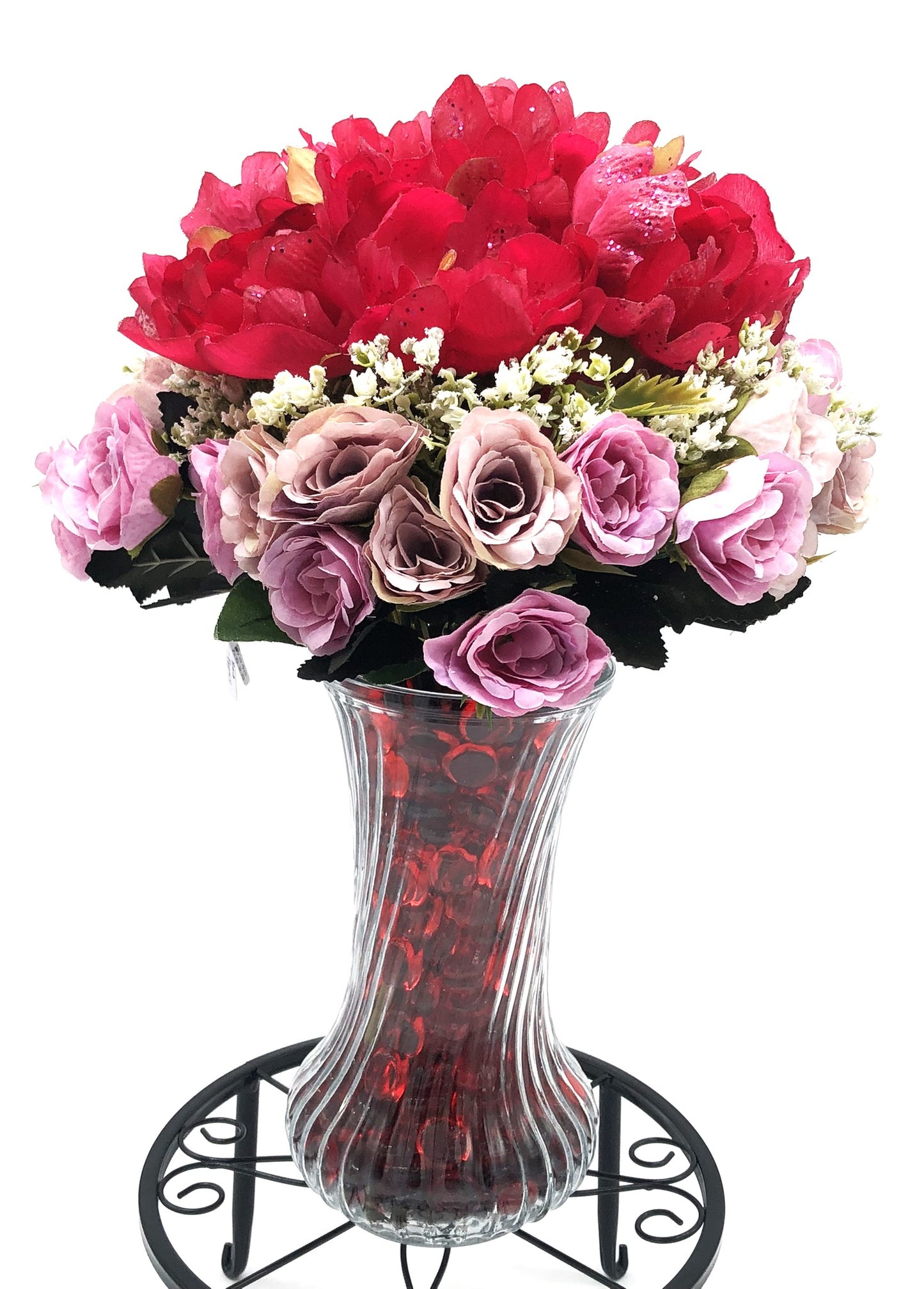 Red/Purple Passion Silk Floral Arrangement with baby's breath in glass-swirl vase filled with red translucent gems.