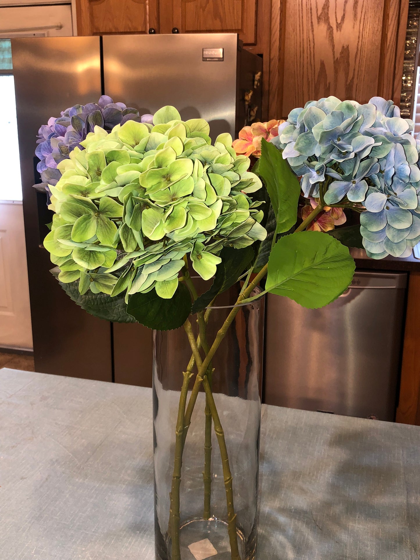 24" Artificial Hydrangea Long-stem bouquet with silk flowers and green leaves. Create your own silk floral design with tall beautiful flowers.