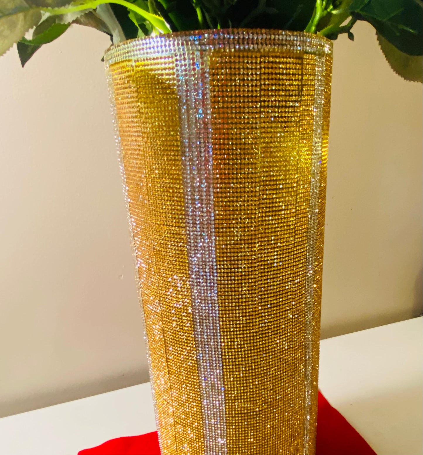 Vibrant Gold V-Style Crystal Rhinestone Cylinder Vase is 15" tall. Long-stem silk floral arrangement sold separately.