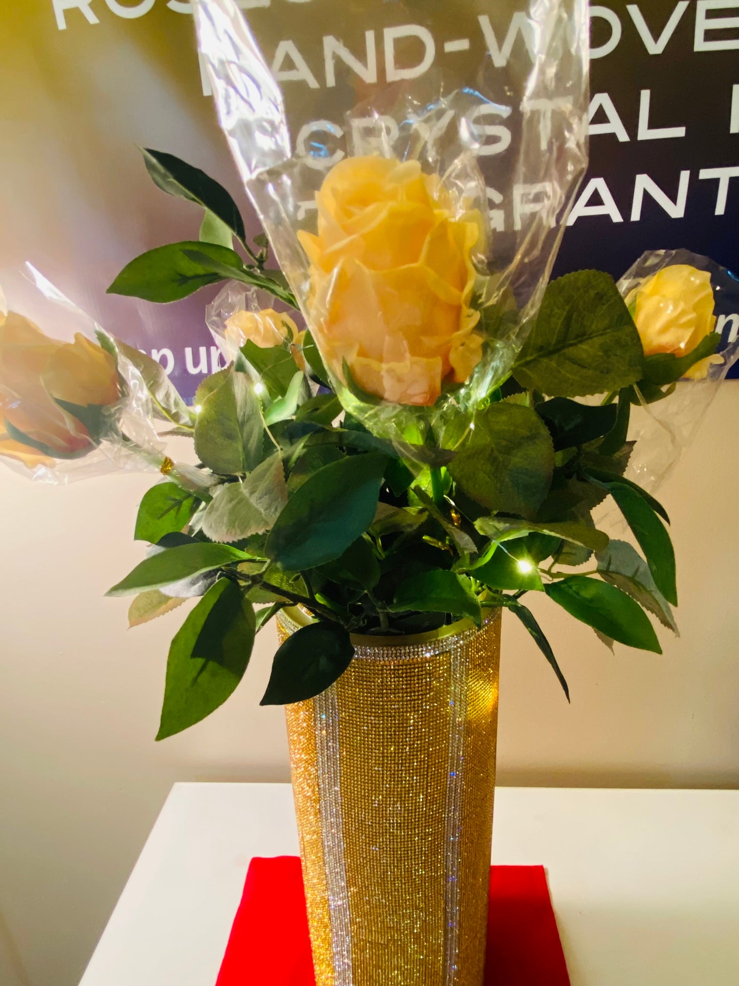 Vibrant Gold V-Style Crystal Rhinestone Cylinder Vase is 15" tall. Long-stem silk floral arrangement sold separately.