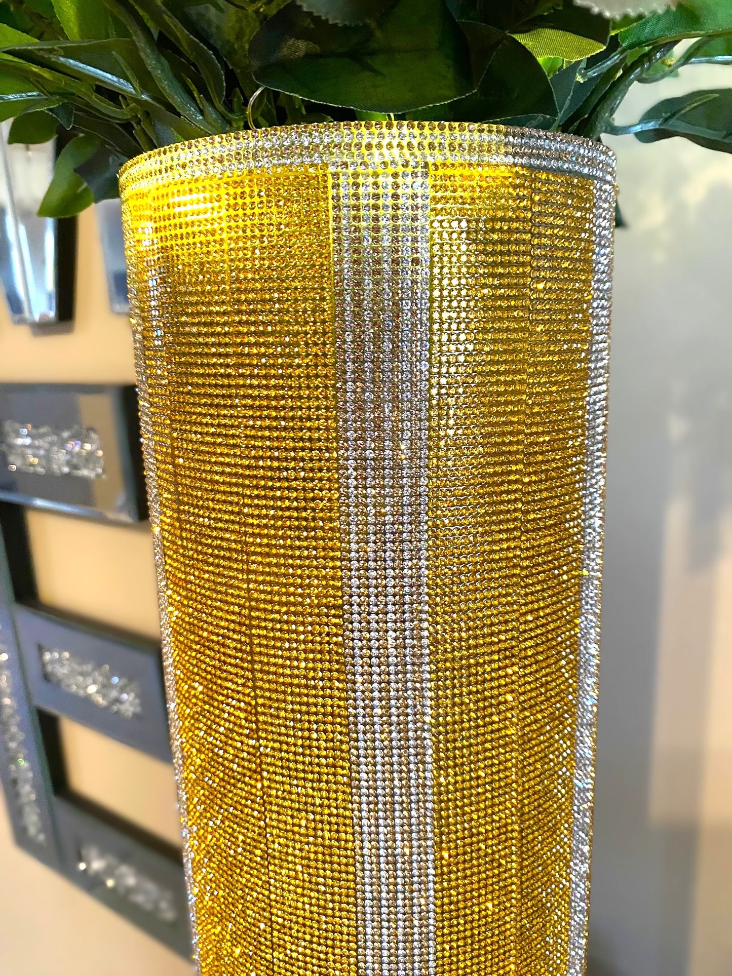 Vibrant Gold V-Style Crystal Rhinestone Cylinder Vase is 15" tall. Long-stem silk floral arrangement sold separately.