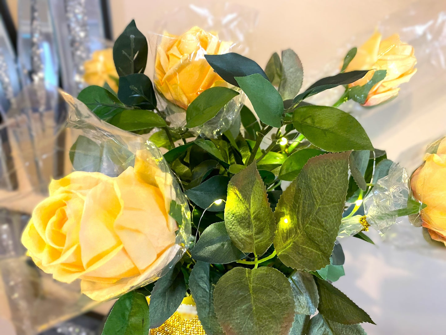 Vibrant Gold V-Style Crystal Rhinestone Cylinder Vase is 15" tall. Long-stem silk floral arrangement sold separately.