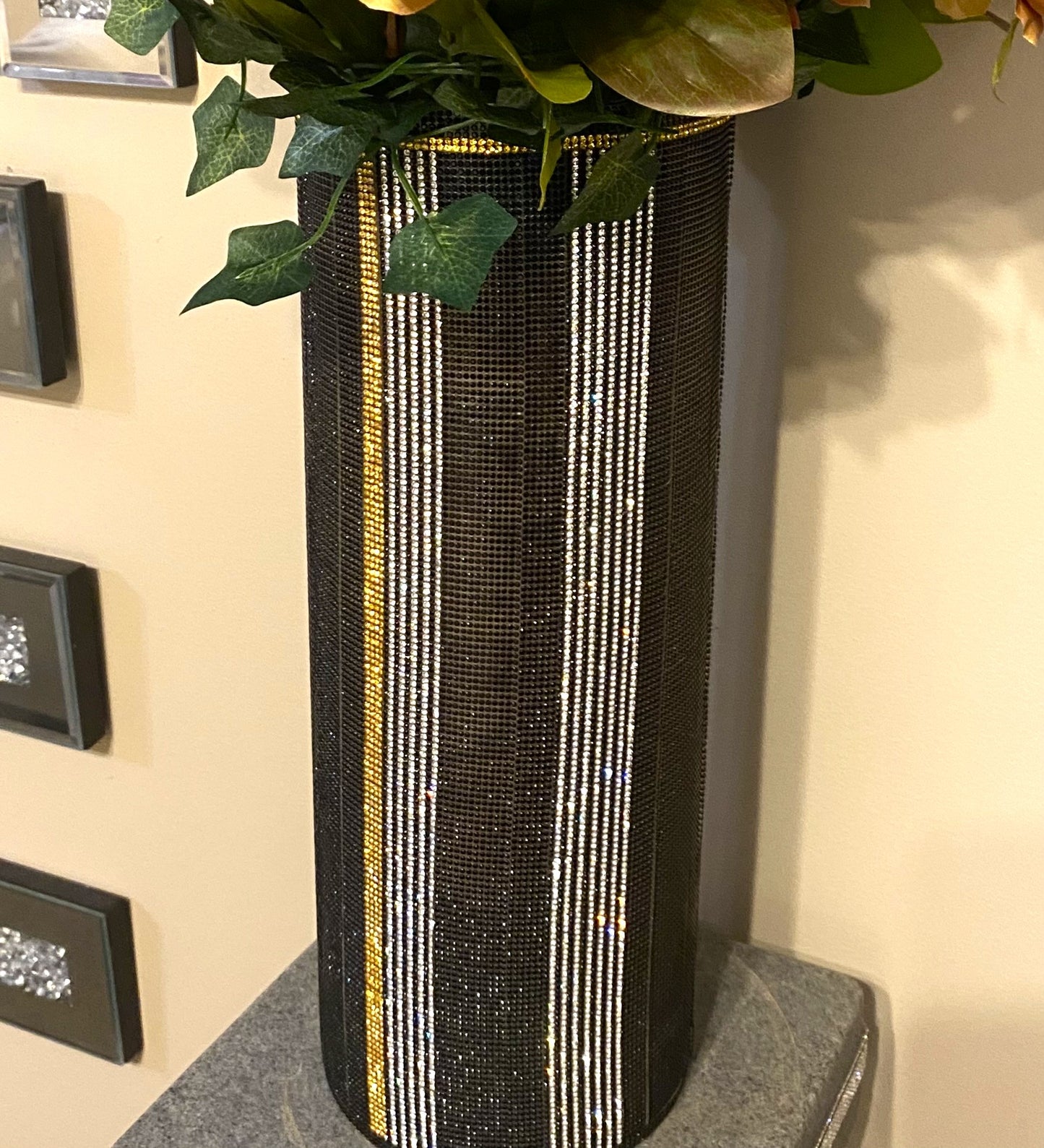 Crystal Rhinestone Cylinder Vase (glass) is 15" tall, Black, Silver & Gold V-Style. Long-stem silk floral arrangement sold separately.