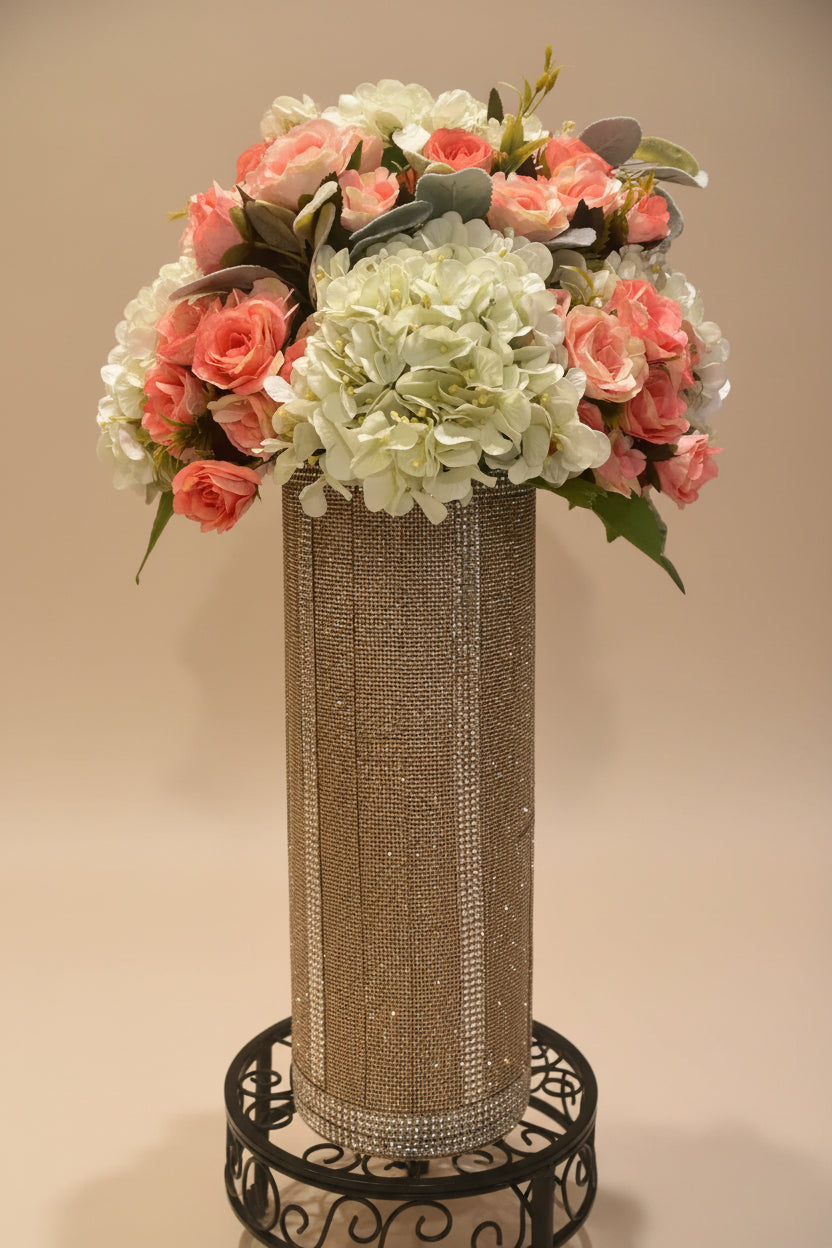 Rose Hydrangea floral arrangement in a champagne crystal rhinestone vase with greenery designed by bling-it-werks.com
