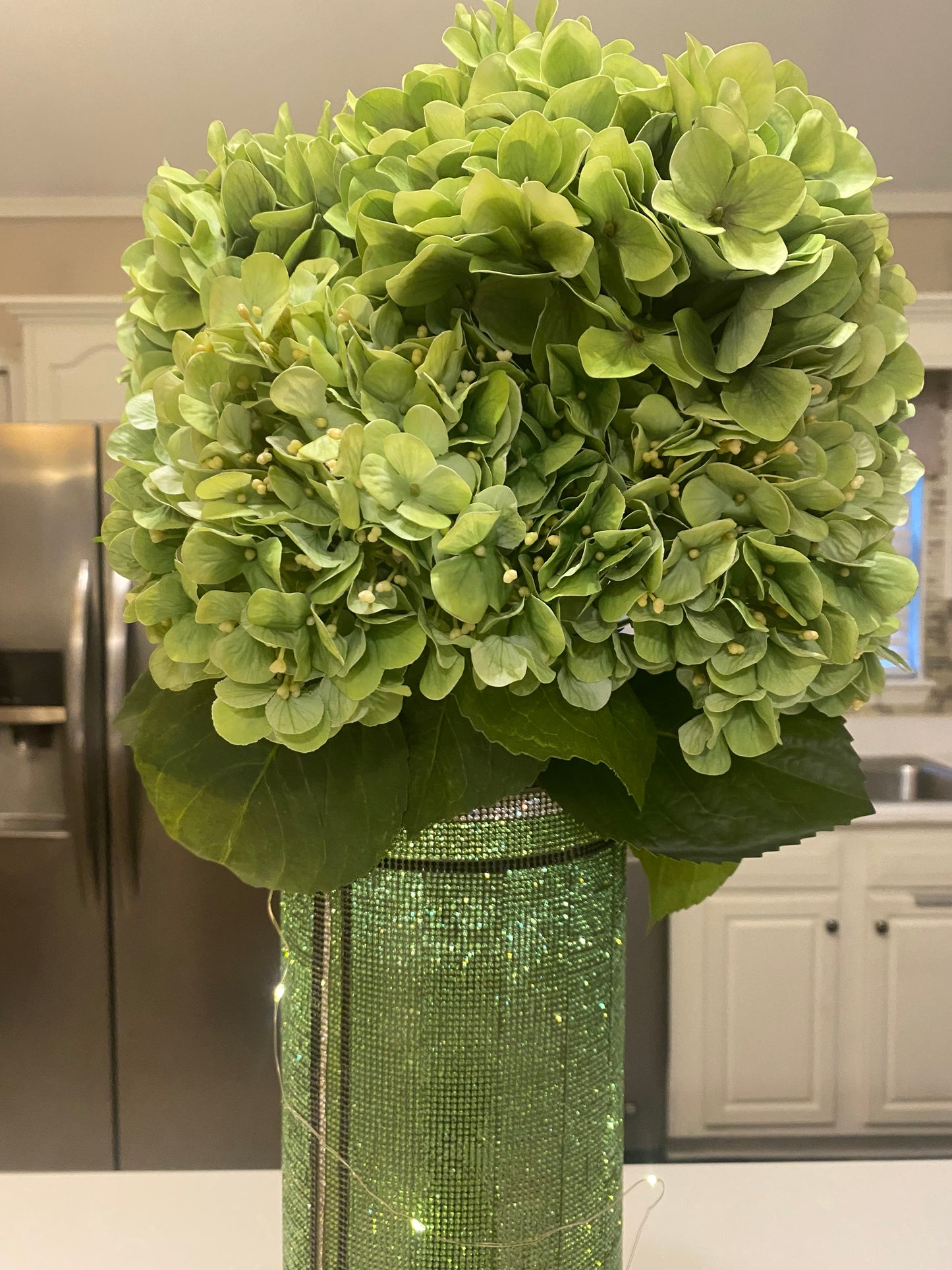 Crystal Rhinestone Vase Green (heavy, cylinder, glass) is 15" tall. Long-stem silk floral arrangements sold separately.