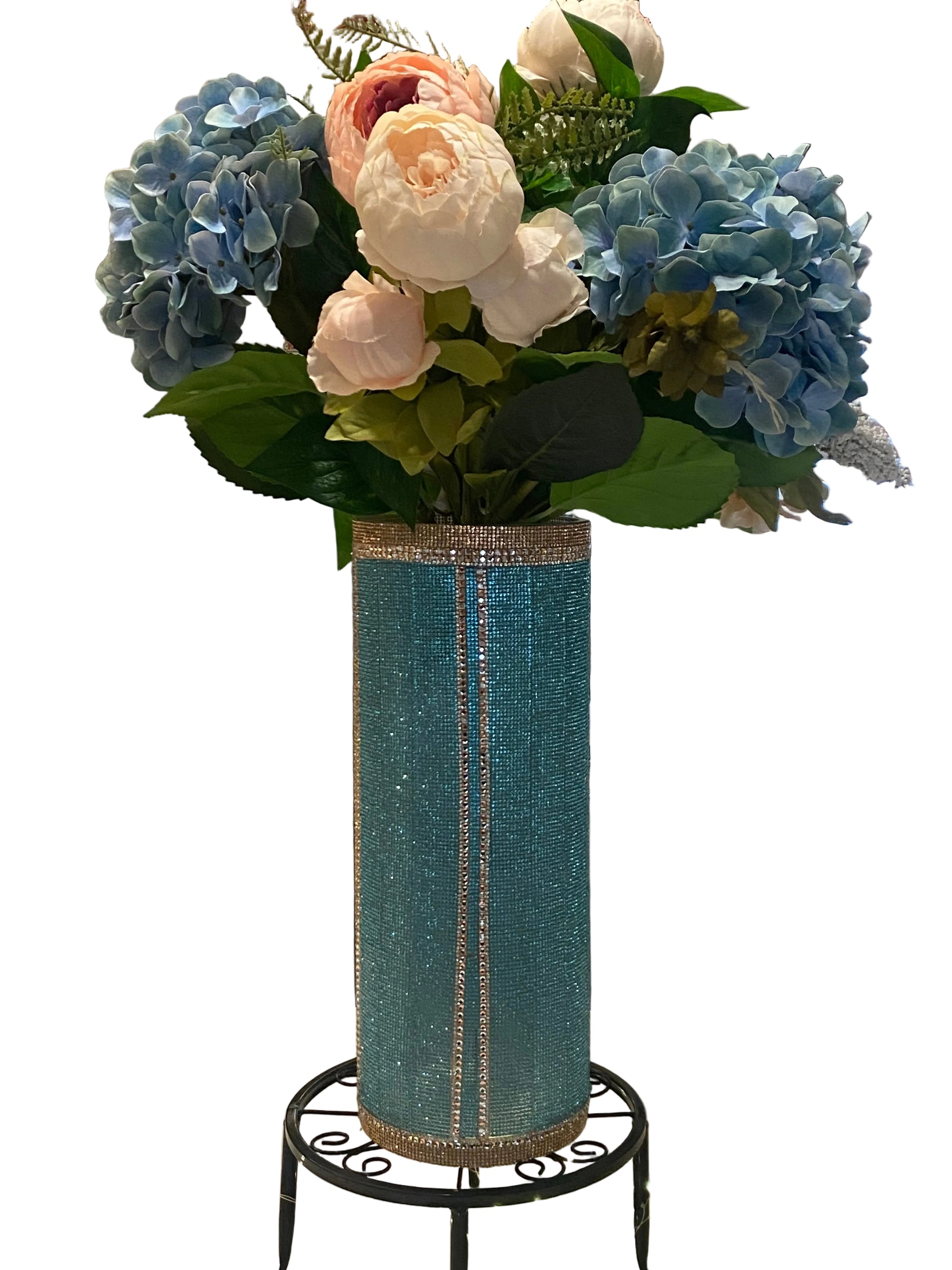 Lake blue crystal rhinestone vase filled with peonies, hydrangea and greenery