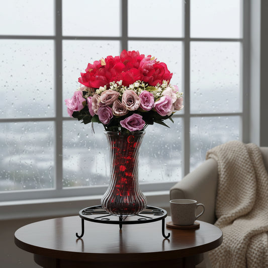 Red/Purple Passion Silk Floral Arrangement with baby's breath in glass-swirl vase filled with red translucent gems.