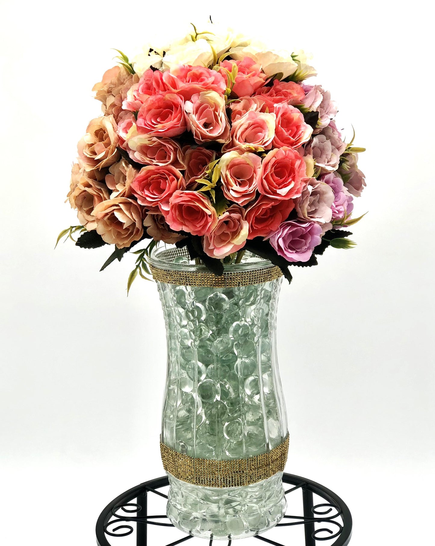 Rose Color Medley in Sculpted-Glass Vase with Crystal Rhinestone trim. Lucious bouquet of small roses with greenery a beautiful silk floral arrangement.