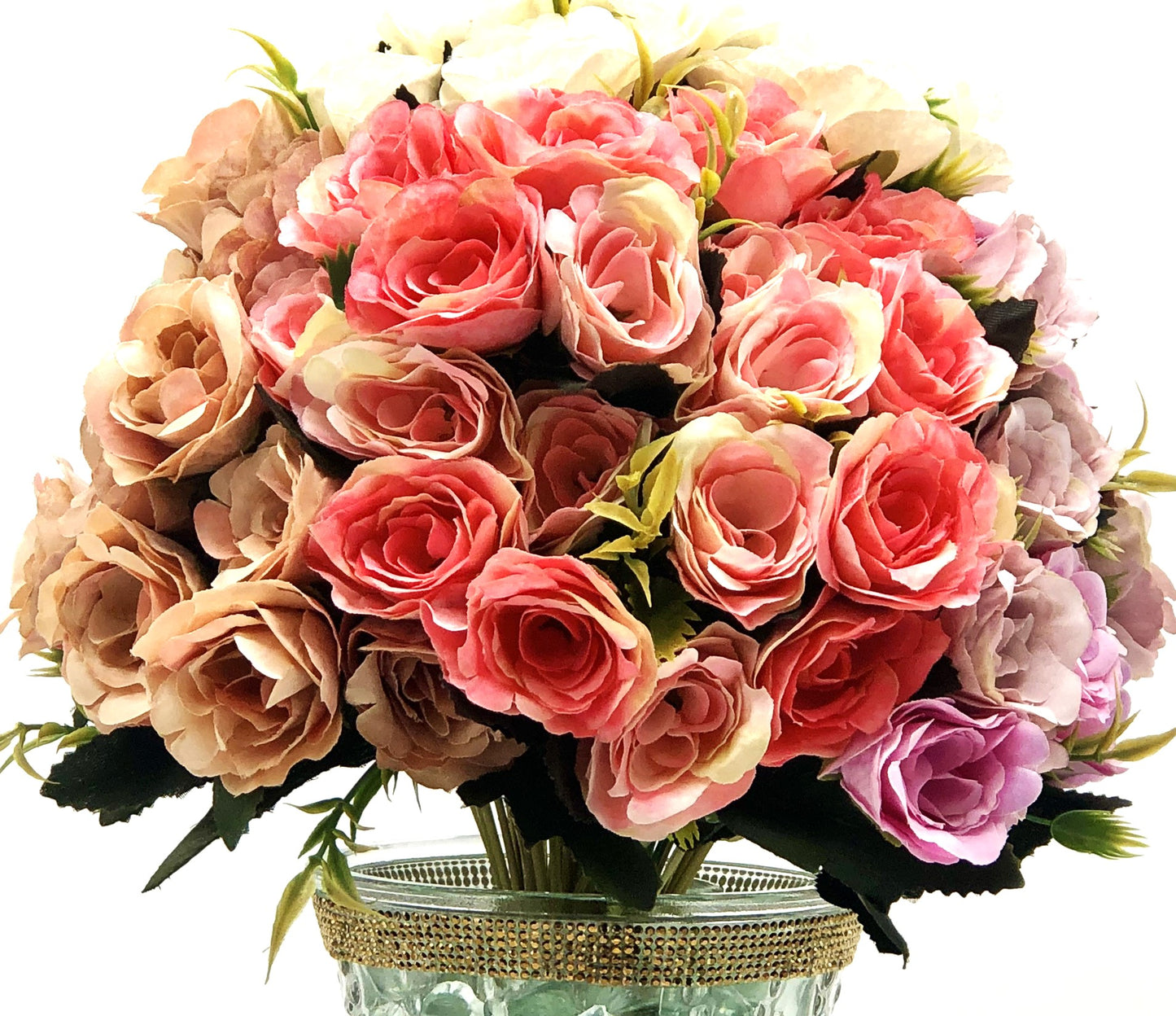 Rose Color Medley in Sculpted-Glass Vase with Crystal Rhinestone trim. Lucious bouquet of small roses with greenery a beautiful silk floral arrangement.