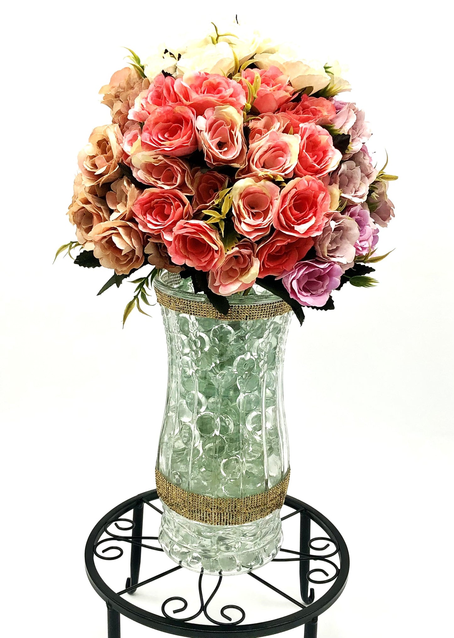Rose Color Medley in Sculpted-Glass Vase with Crystal Rhinestone trim. Lucious bouquet of small roses with greenery a beautiful silk floral arrangement.
