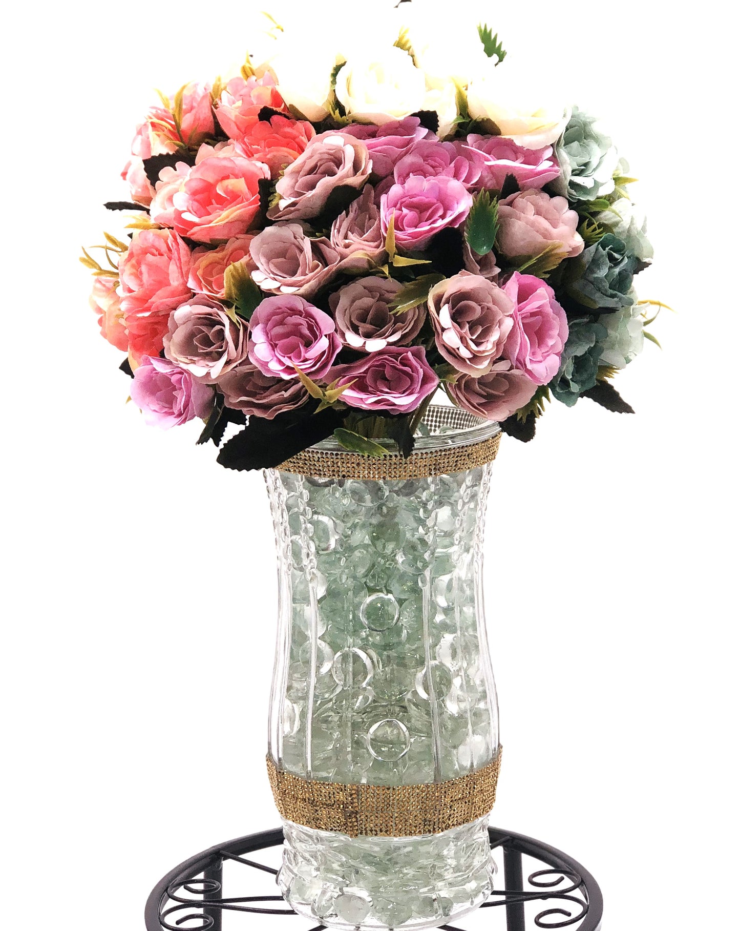 Rose Color Medley in Sculpted-Glass Vase with Crystal Rhinestone trim. Lucious bouquet of small roses with greenery a beautiful silk floral arrangement.