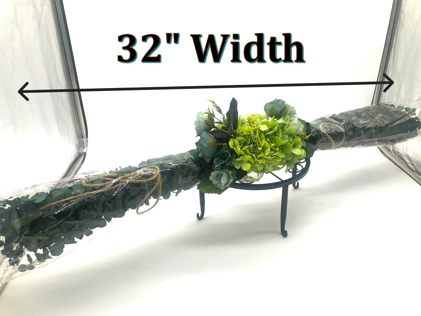 Eucalyptus Swag with Green Hydrangea, small rose bouquet, gold bow and crystal rhinestone trim. Real Eucalyptus. 32" width.