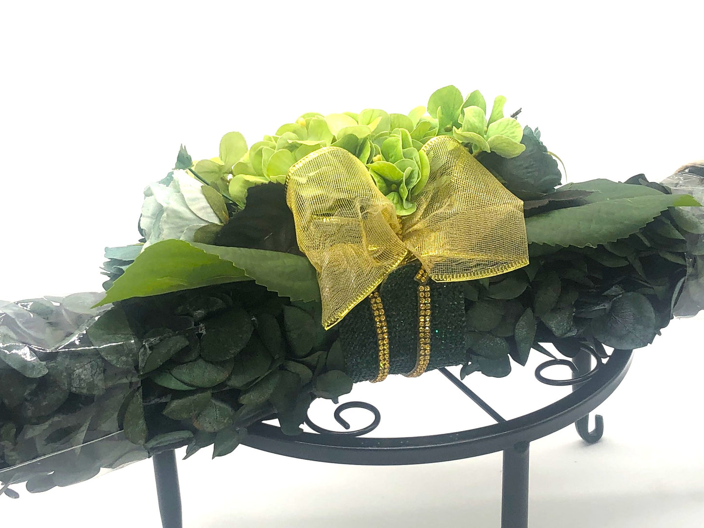 Eucalyptus Swag with Green Hydrangea, small rose bouquet, gold bow and crystal rhinestone trim. Real Eucalyptus. 32" width.
