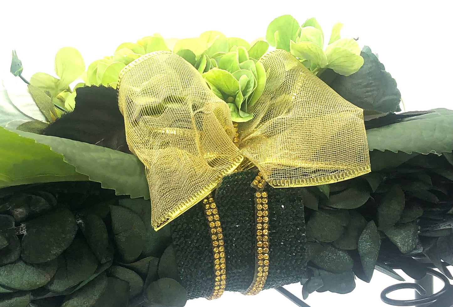 Eucalyptus Swag with Green Hydrangea, small rose bouquet, gold bow and crystal rhinestone trim. Real Eucalyptus. 32" width.